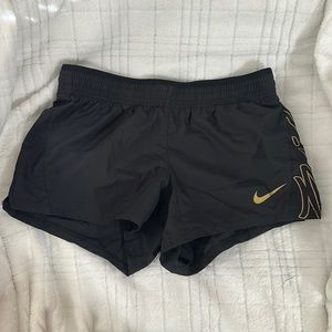Nike black and gold running shorts. Size XS.